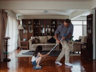 Person cleaning a tidy home living space