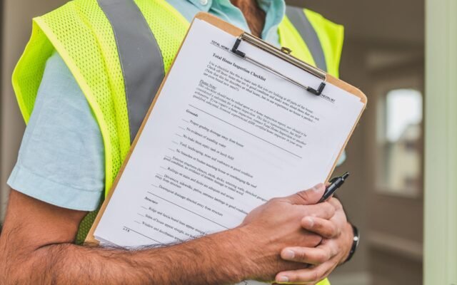 Homeowner reviewing a seasonal home maintenance checklist