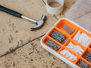 Basic DIY tools laid out for a beginner home project