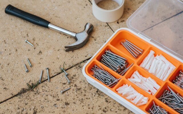 Basic DIY tools laid out for a beginner home project