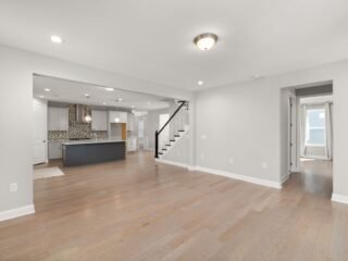 Open floor plan connecting kitchen, dining, and living areas
