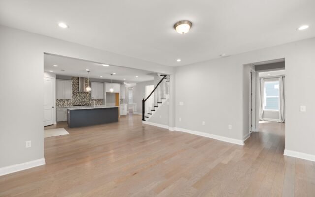 Open floor plan connecting kitchen, dining, and living areas