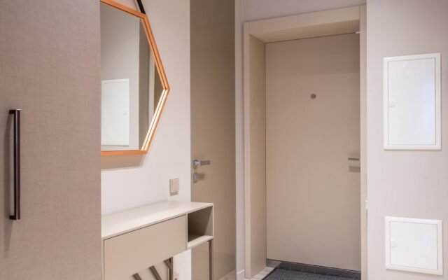 Organized home entryway with a storage bench and wall hooks