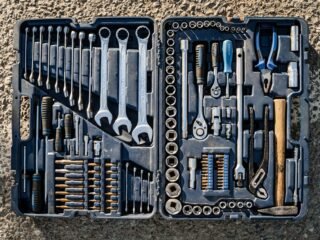 Basic hand tools laid out in a toolbox