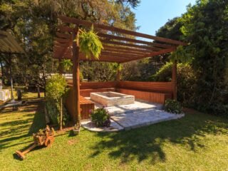 Well maintained backyard garden with layered planting beds