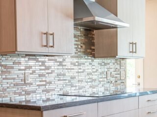 Updated kitchen backsplash and cabinet hardware