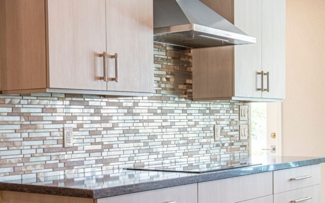 Updated kitchen backsplash and cabinet hardware