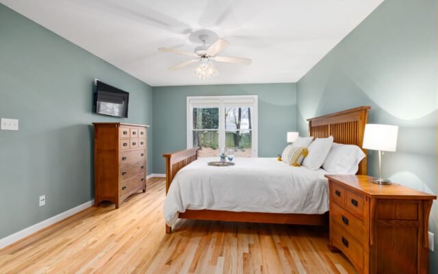 Welcoming guest room with fresh linens and warm lighting
